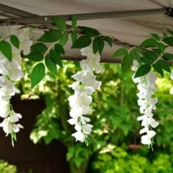 Solar Powered 180cm Artificial Leaf Garland With Wisteria Flowers - Warm White -EcoPatio Shop 379258 180cm solar powered artificial leaf garland with wisteria flowers 20 warm white micro leds
